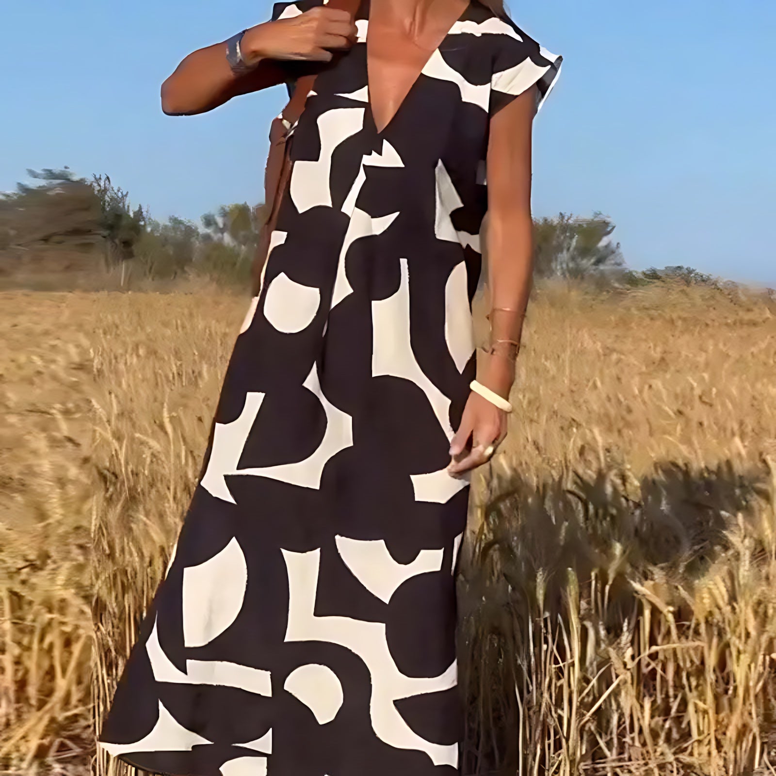 Amaya – Abstract Print V Neck Flowy Maxi Dress